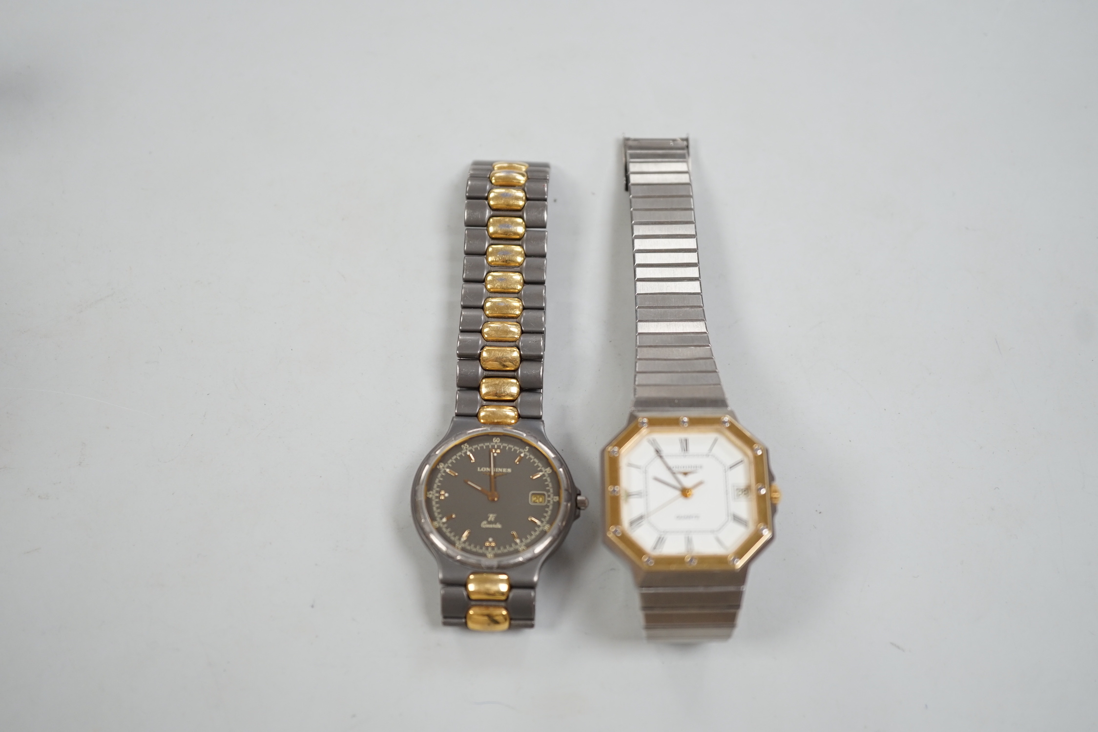 Two gentleman's steel and gold plated Longines quartz wrist watches, one with octagonal case.